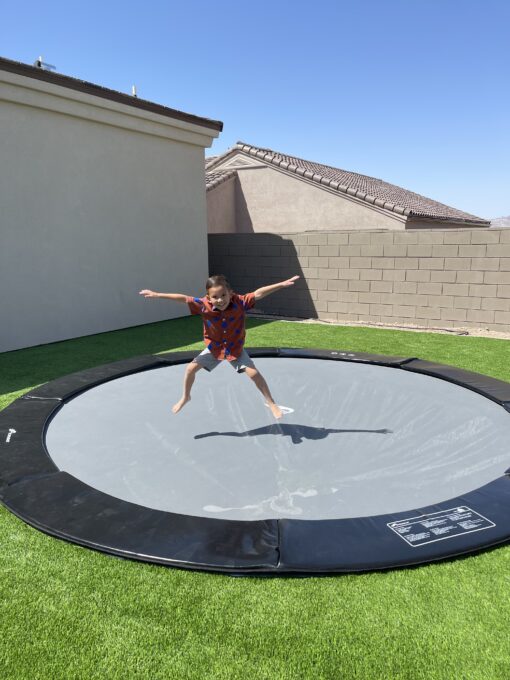 Child jumping on trampoline